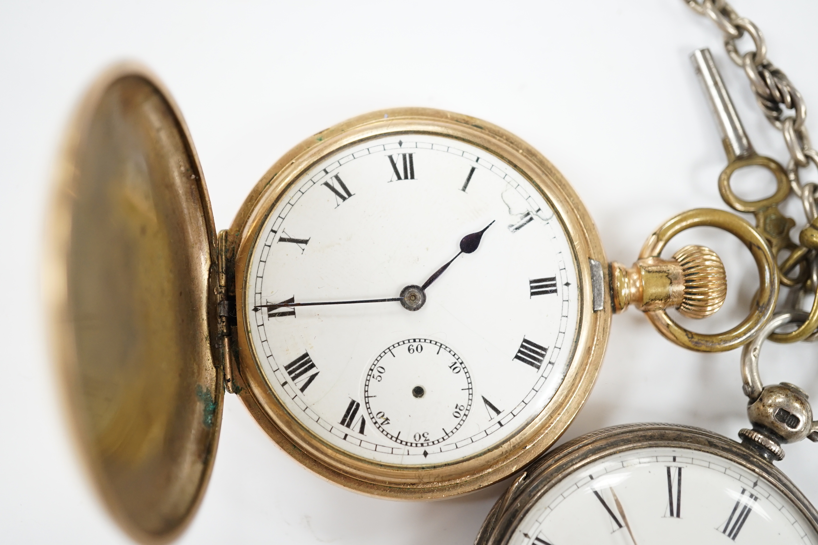 A 1920's silver open face pocket watch and a gold plated hunter pocket watch.